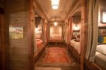 5 twin beds in bunk room